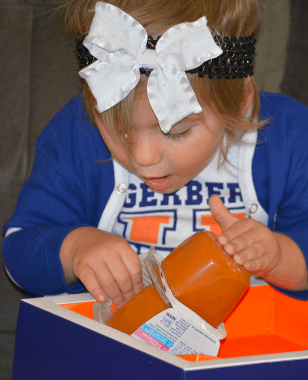 She was so excited and tried to open the food RIGHT when we got it out of the box before we could sit in our high chair to enjoy it!